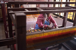 A woman weaves dhaka fabric by hand in Nepal | Where in the World Apparel